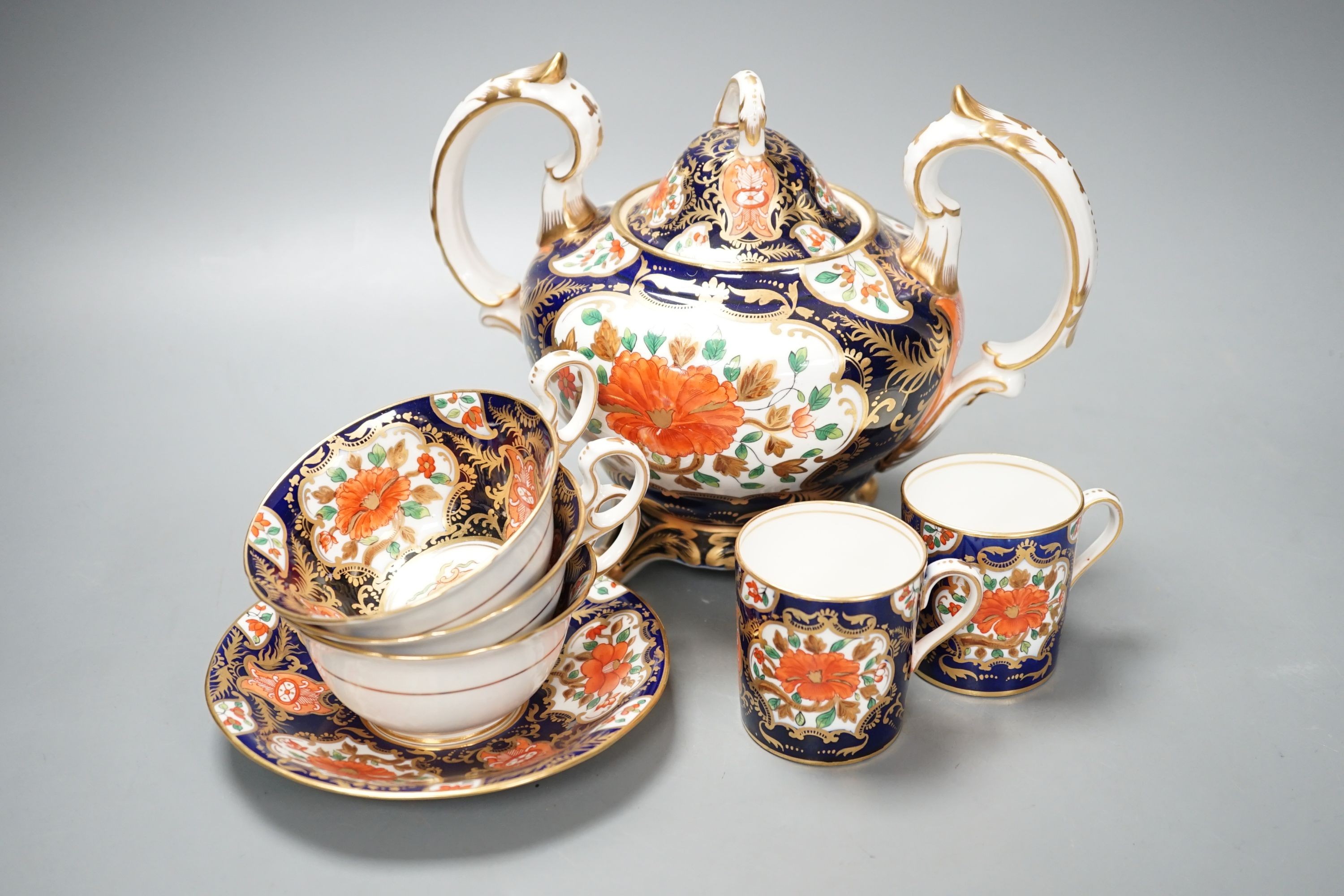 A mid 19th century English bone china fifty-two piece part tea and coffee service, decorated in an Imari pattern